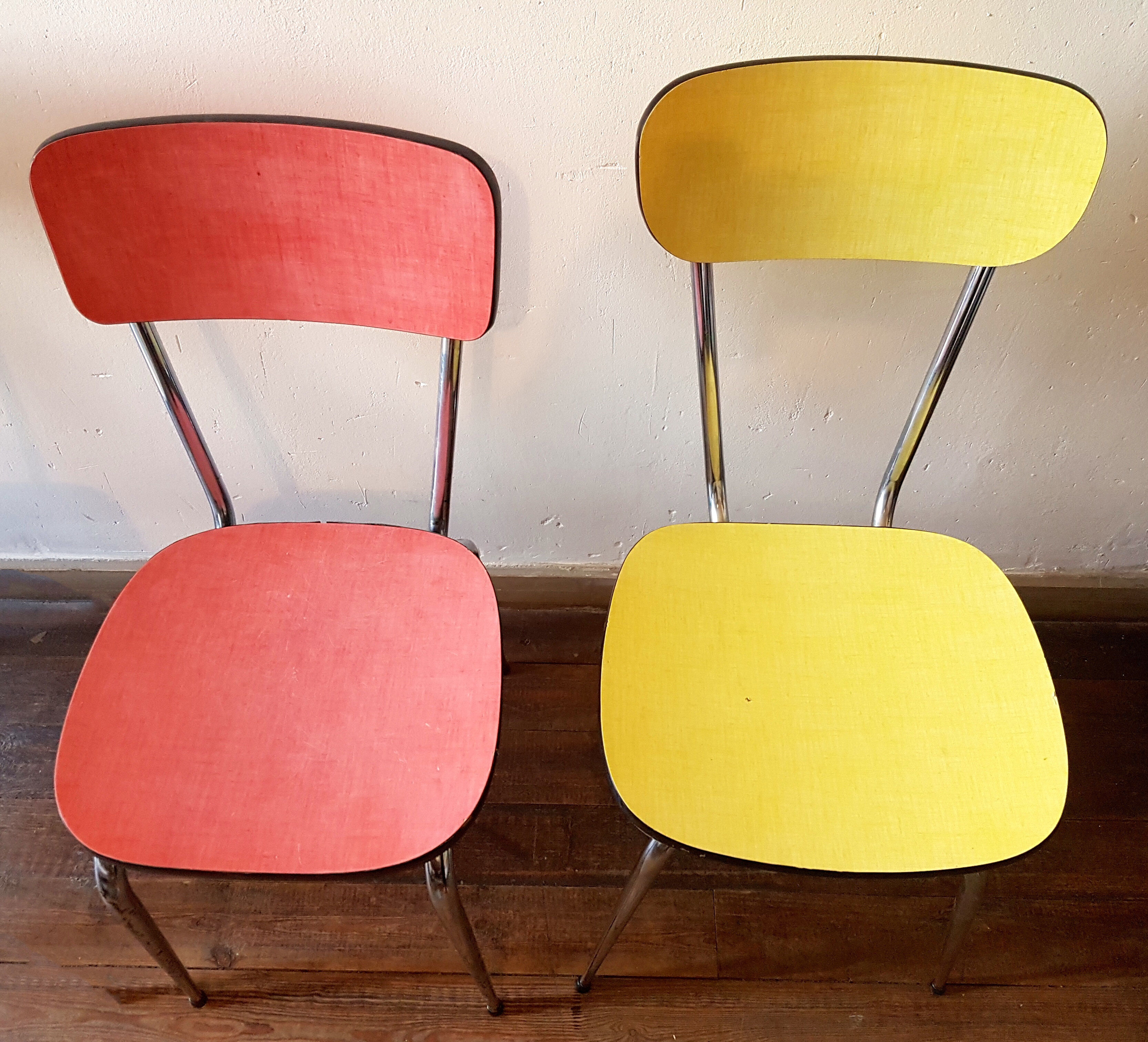 Four formica chairs in different colors