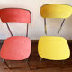 Four formica chairs in different colors