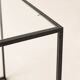Designer coffee table in metal and glass