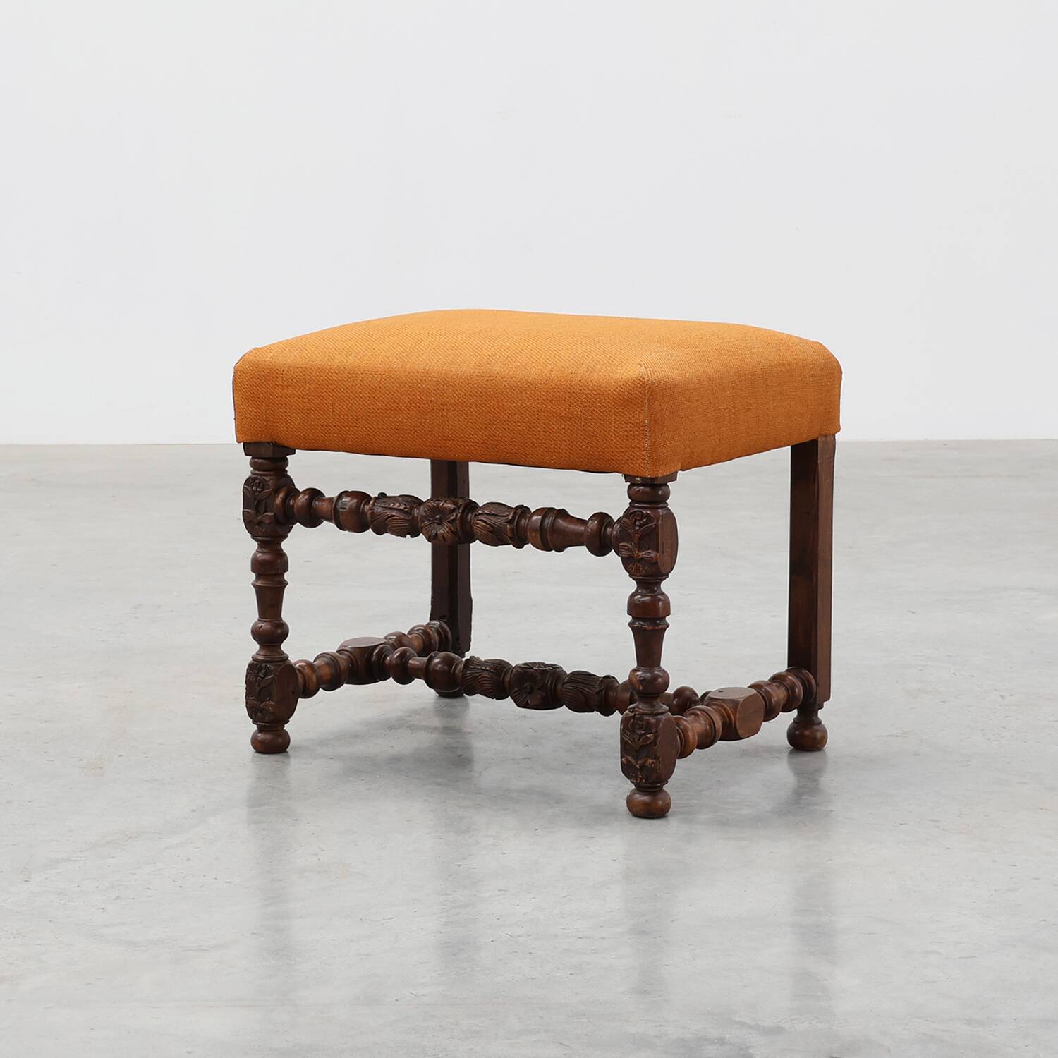 Louis XIII walnut stool with carved turned stretchers and upholstered seat