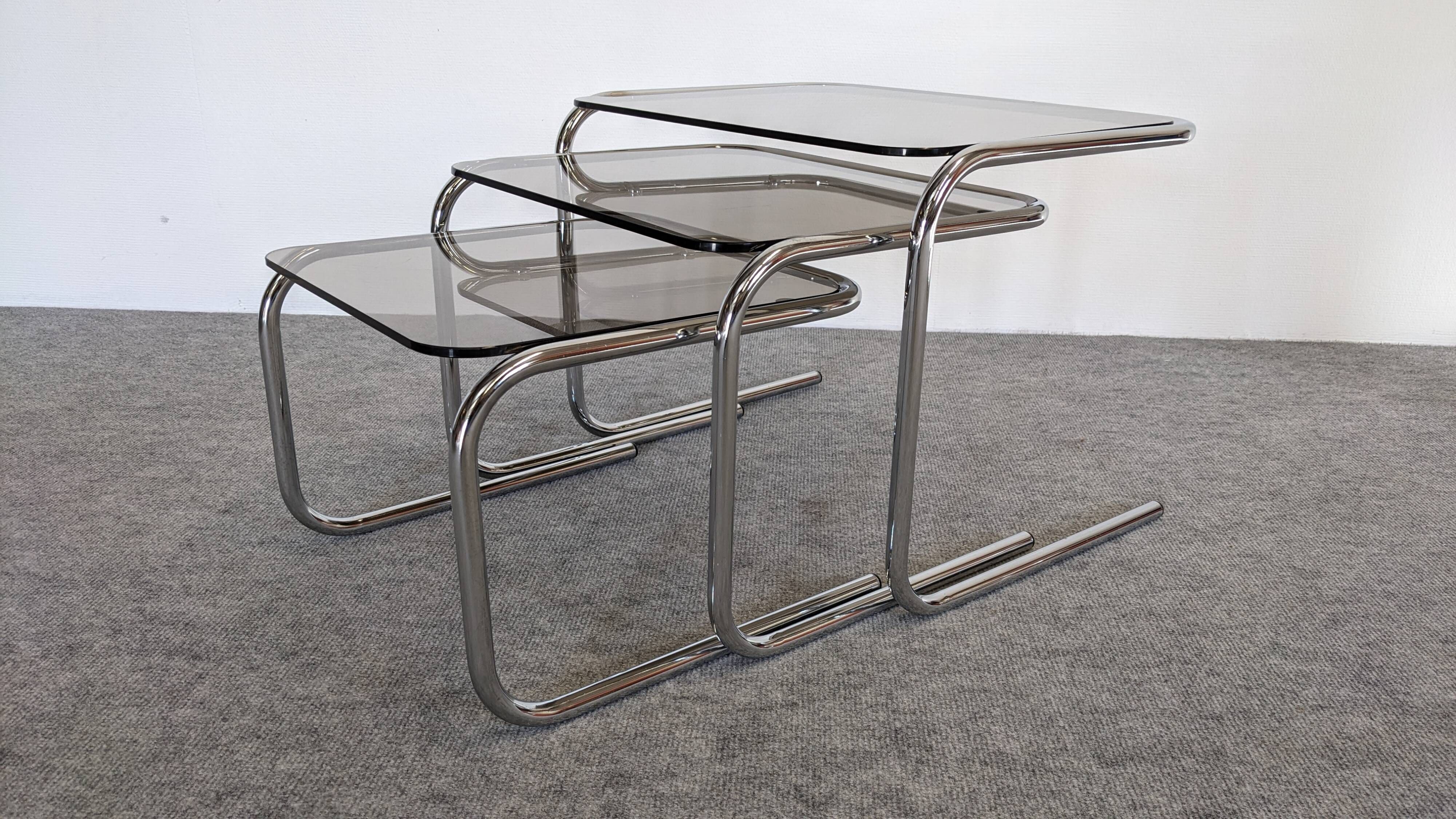 Nested tables with tubular chrome and smoked glass, France 1970.
