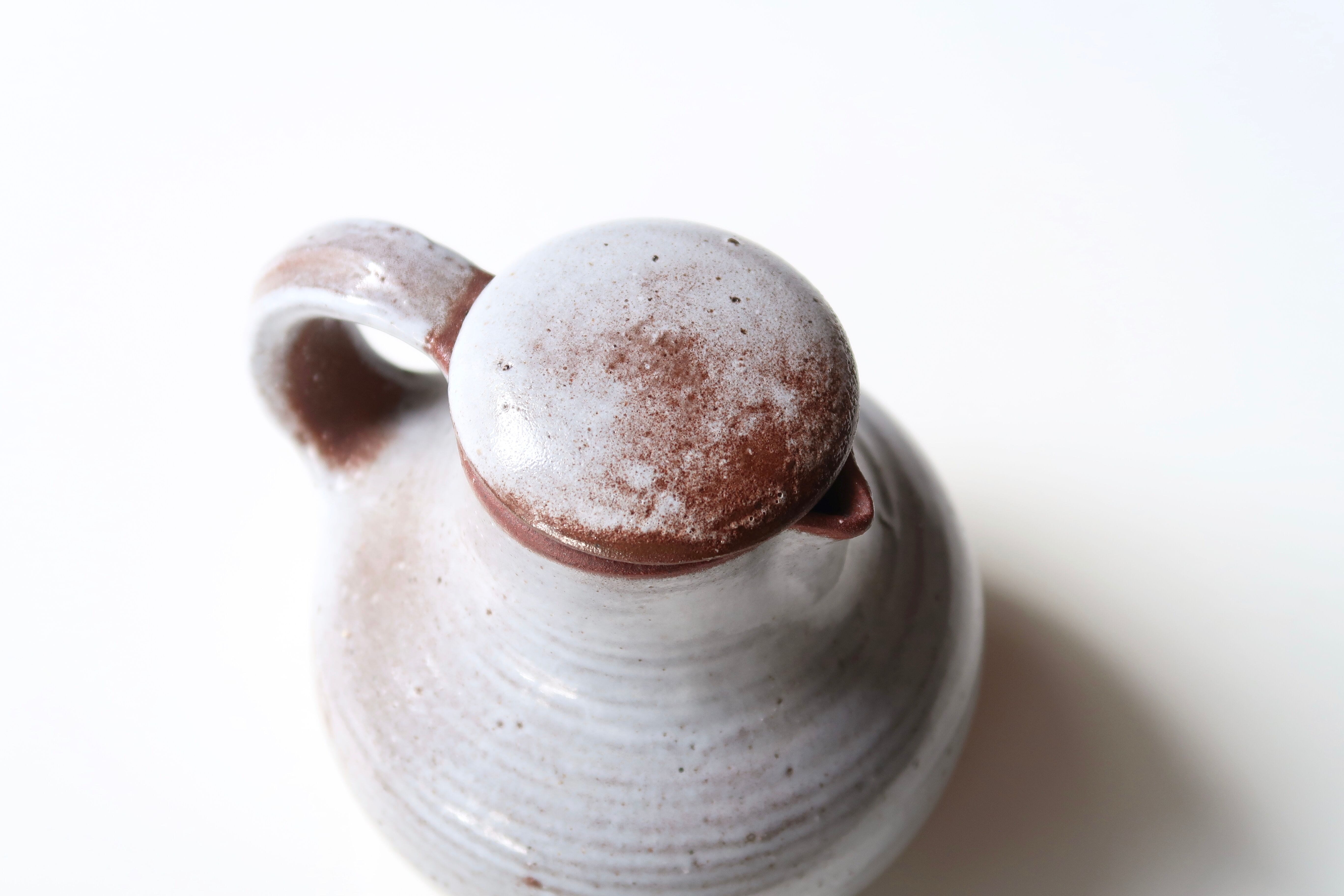 Sandstone milk pitcher by Jeanne and Norbert Pierlot, 60s