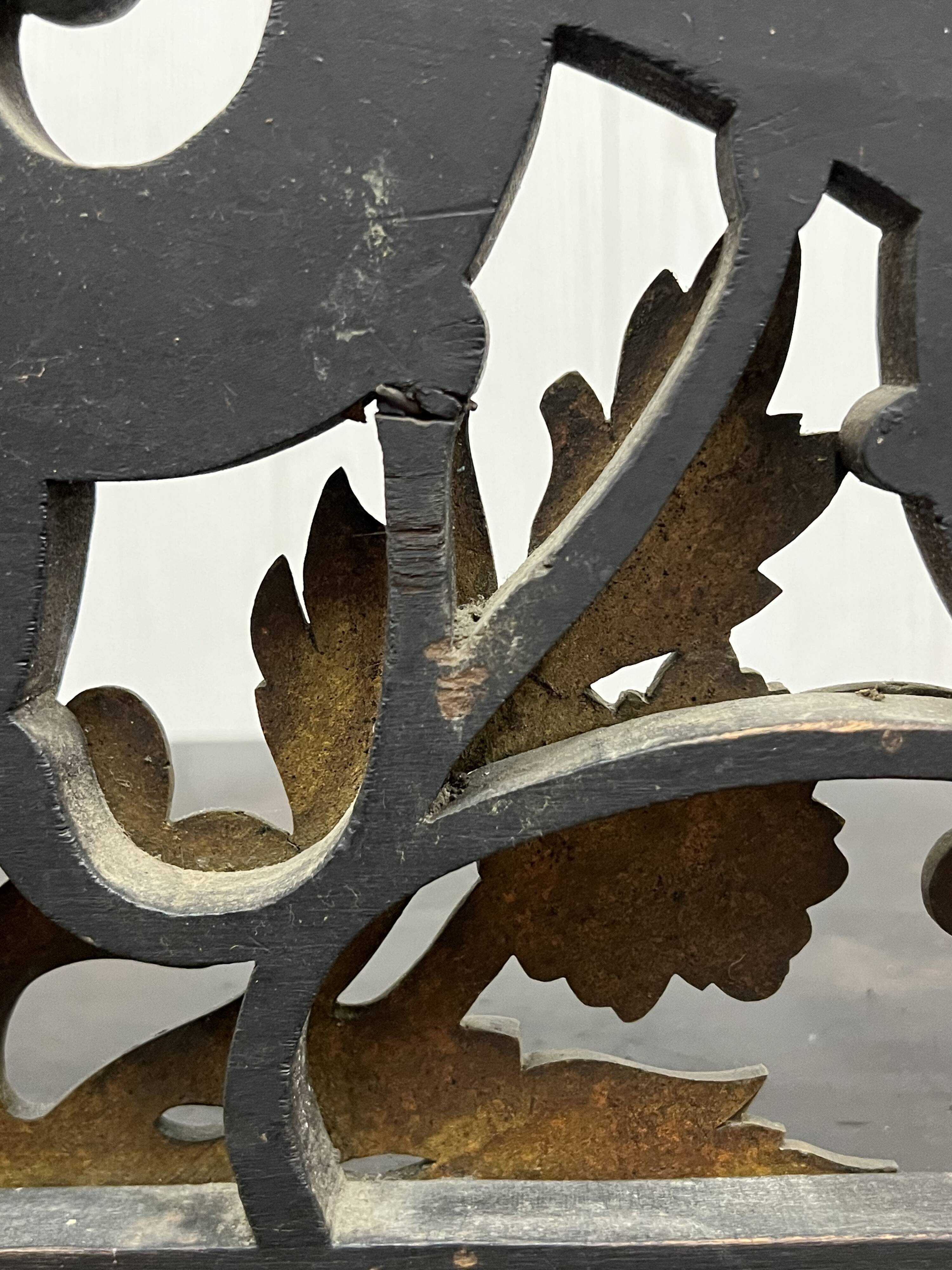 Blackened wooden shelf.