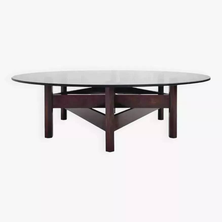 Wooden coffee table with round smoked glass top