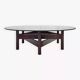 Wooden coffee table with round smoked glass top