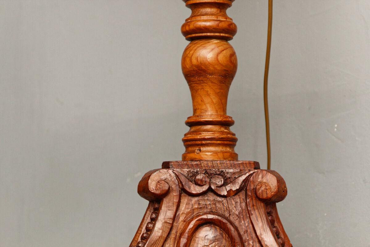 Carved wooden lamp, fiber shade