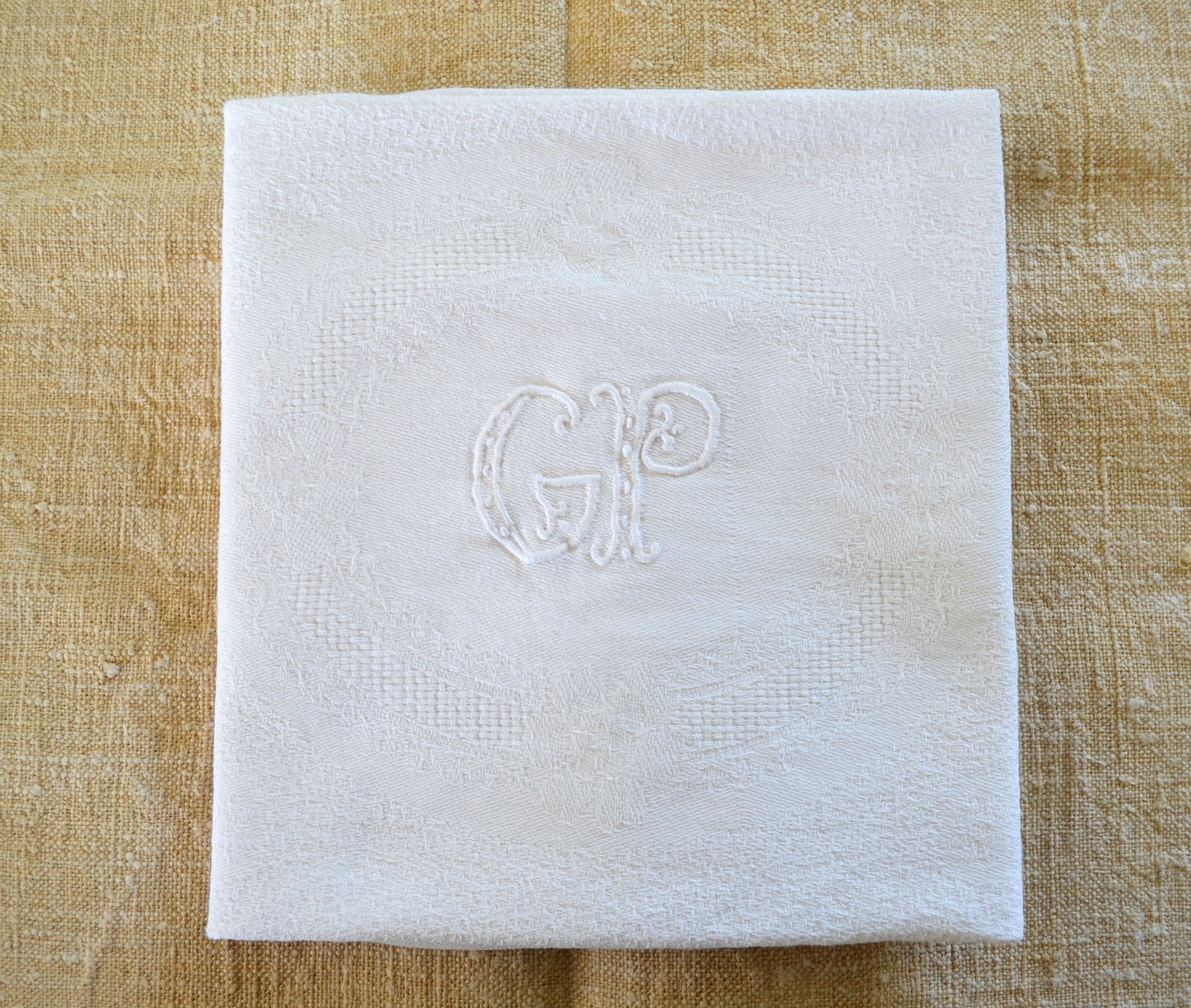 Set of 12 hand-embroidered cotton damask napkins