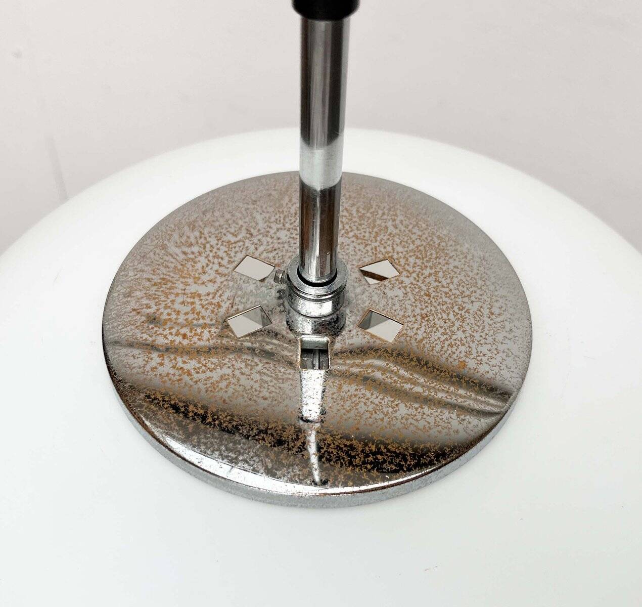 Minimalist suspended glass ball lamp from the vintage German space age by Glashütte Limburg, 1970s.