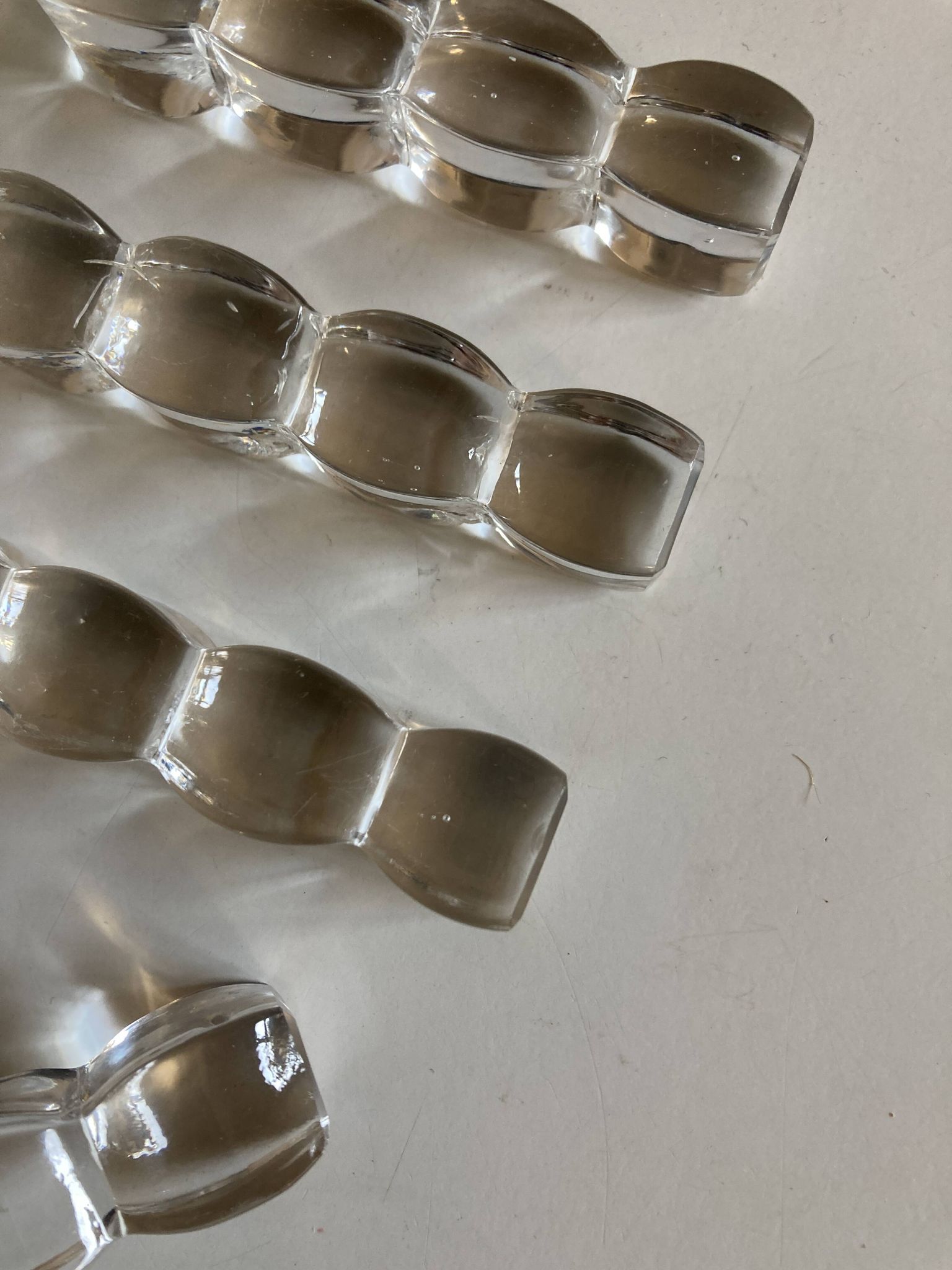 Set of 8 modernist crystal knife rests from the 1940s.