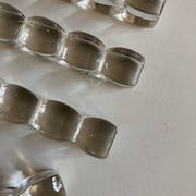 Set of 8 modernist crystal knife rests from the 1940s.