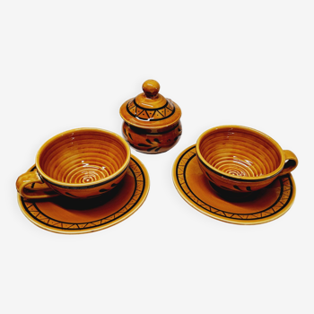 Pair of glazed earthenware breakfast cups and sugar bowl