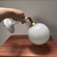 Applique murale inclinable globe opaline blanche