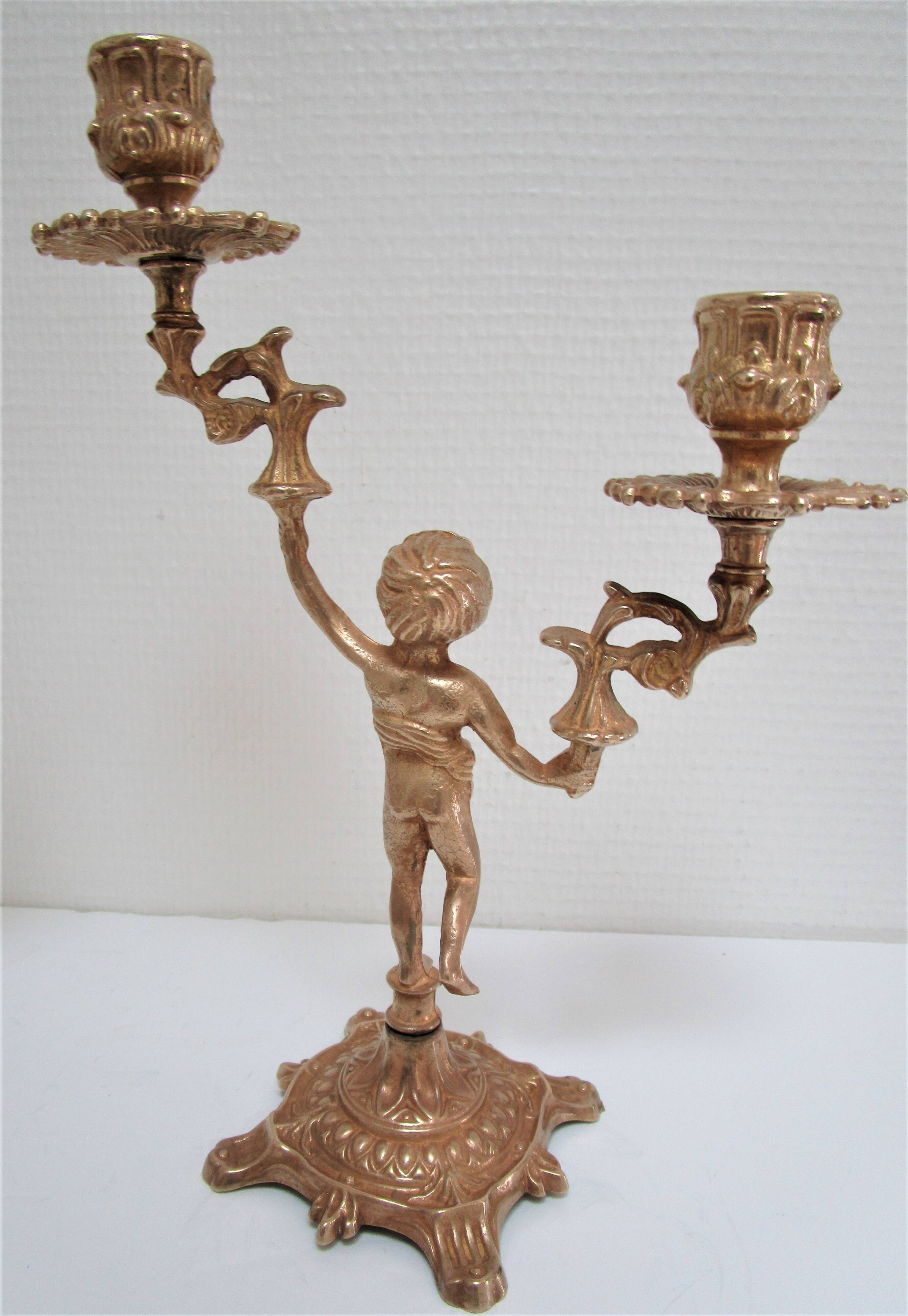 Pair of vintage golden brass cherub candlesticks