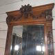 Bevelled mirror in carved wood
