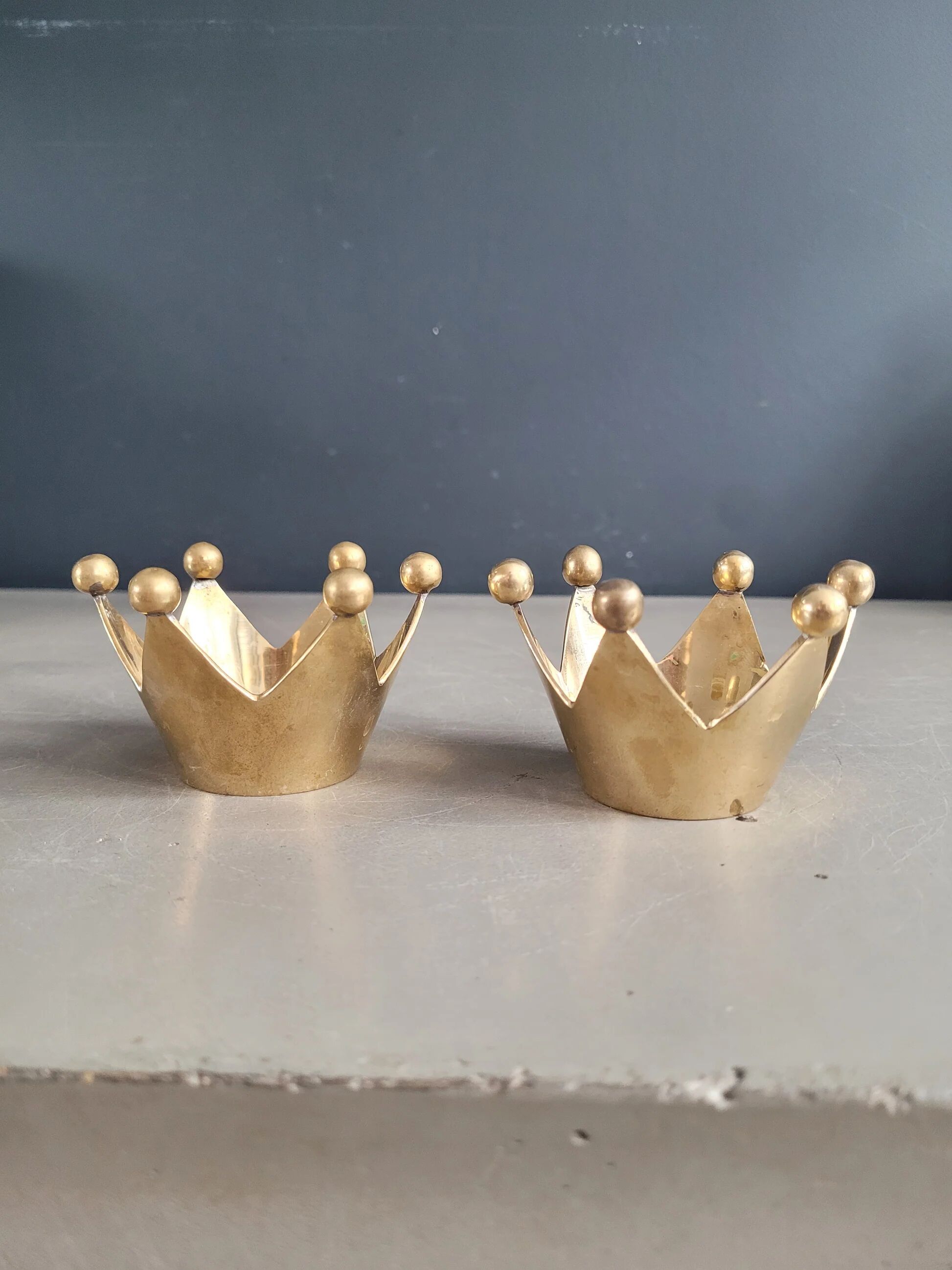 Pair of crown candle holders in brass