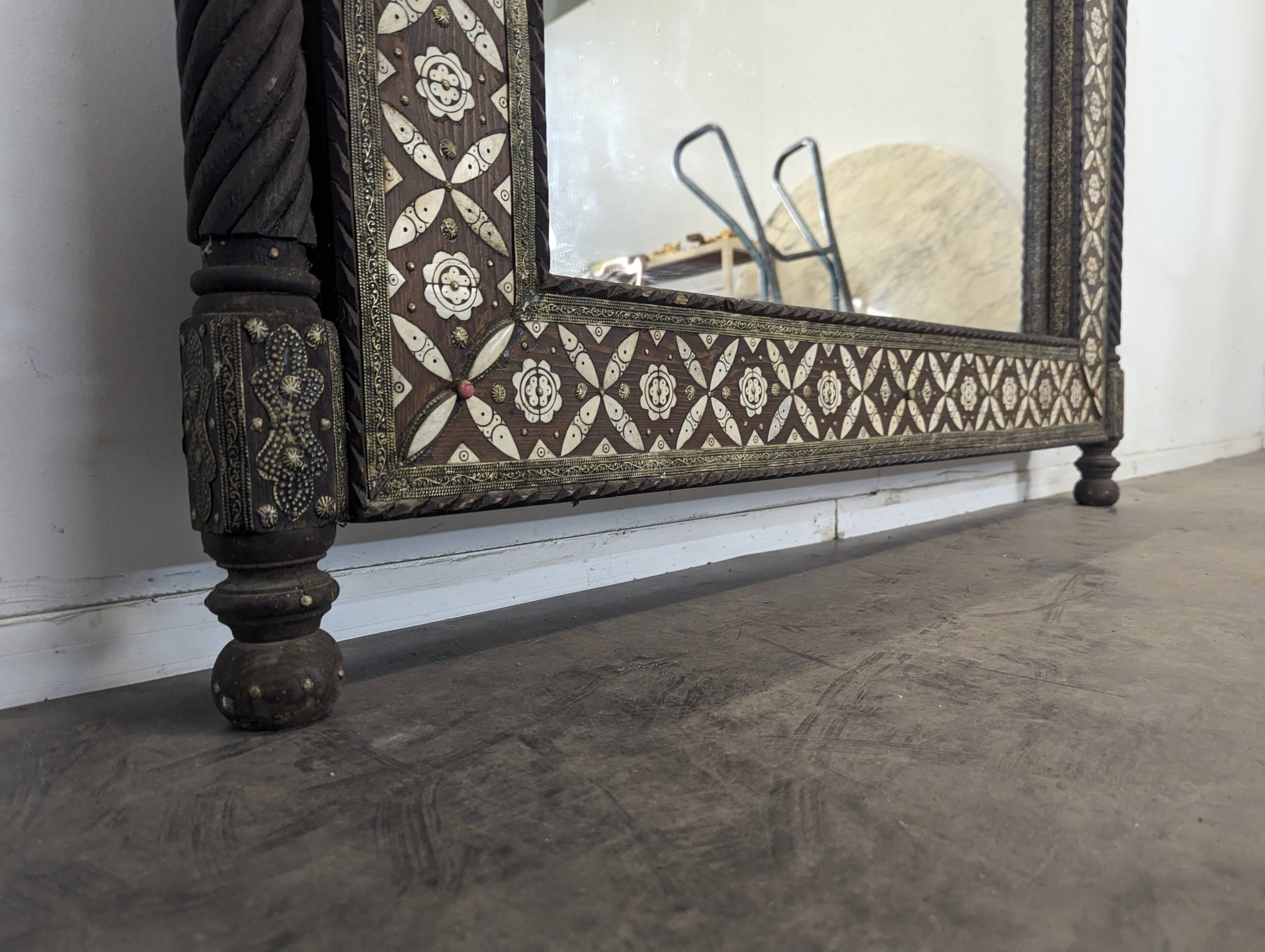 Orientalist mirror with bone inlays and hard stone cabochons.