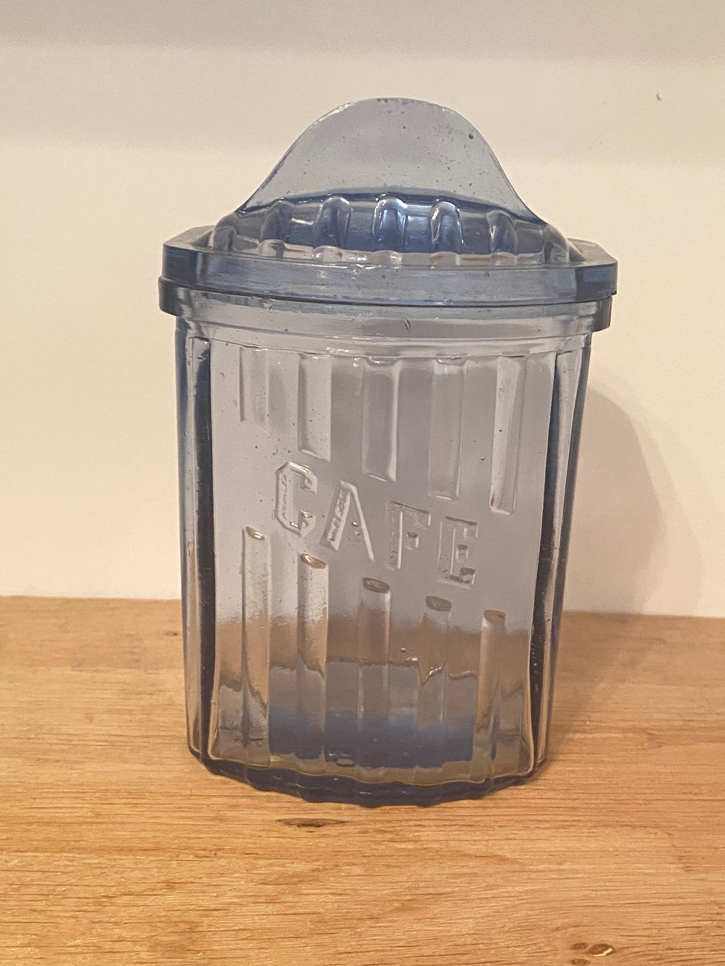 Old coffee pot in blue glass