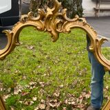 Louis XV Style wood and gilded stucco mirror with animated shape