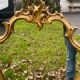 Louis XV Style wood and gilded stucco mirror with animated shape
