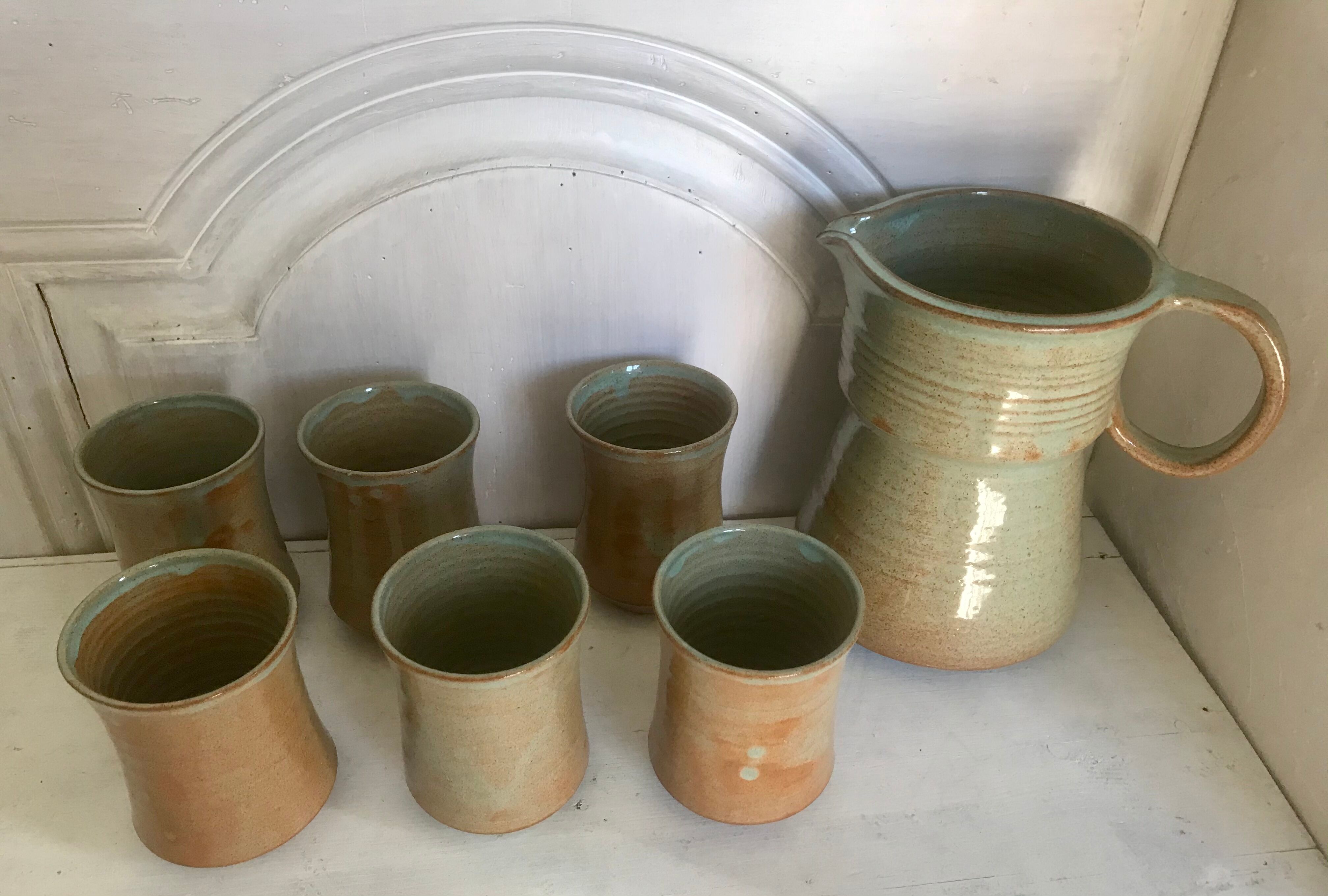 Pitcher and its vintage sandstone glasses