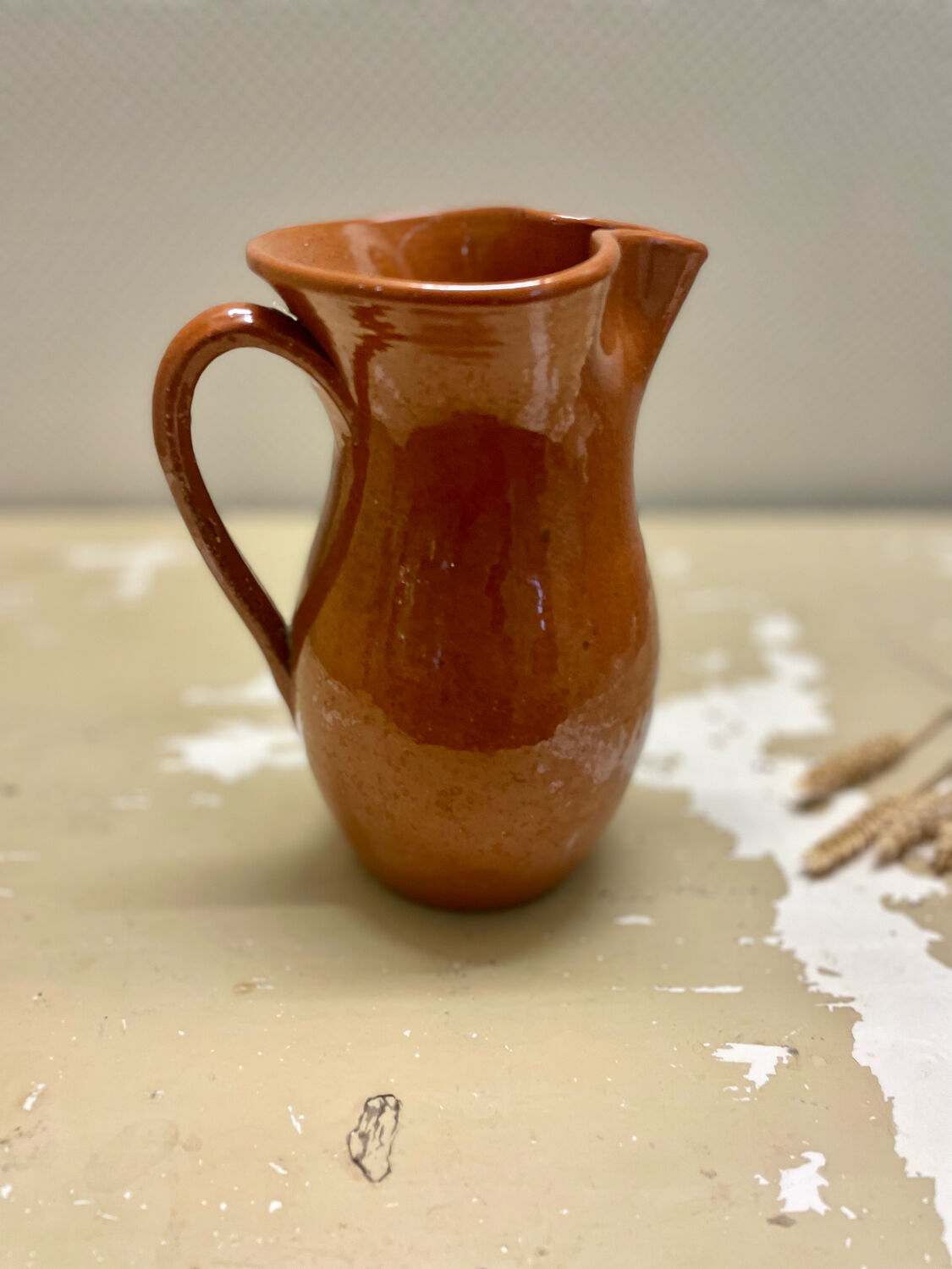 Vintage glazed terracotta pitcher