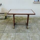 Old bistro table in wood and brass.