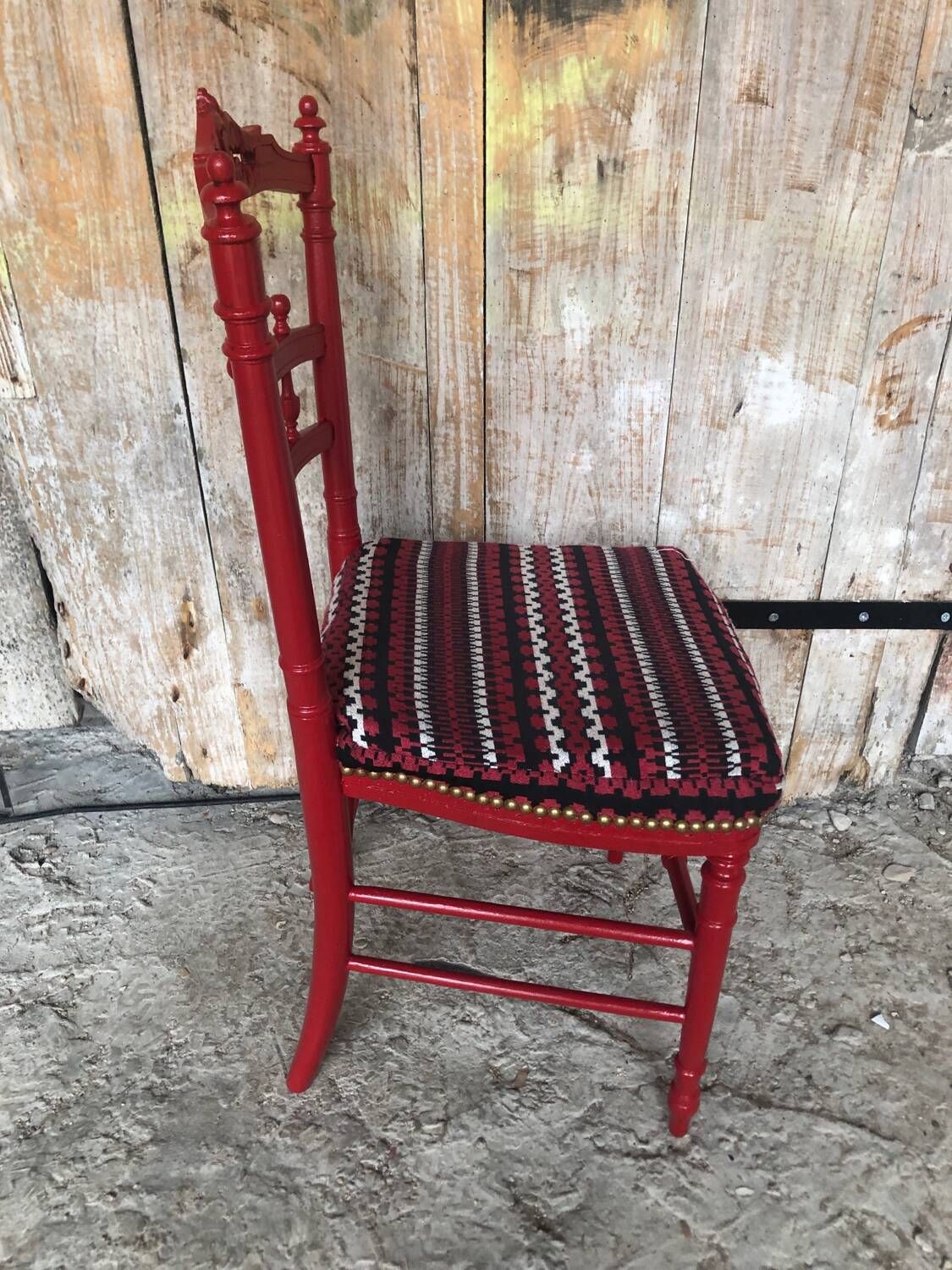 Red carved wood bedroom chair & vintage striped fabric seat