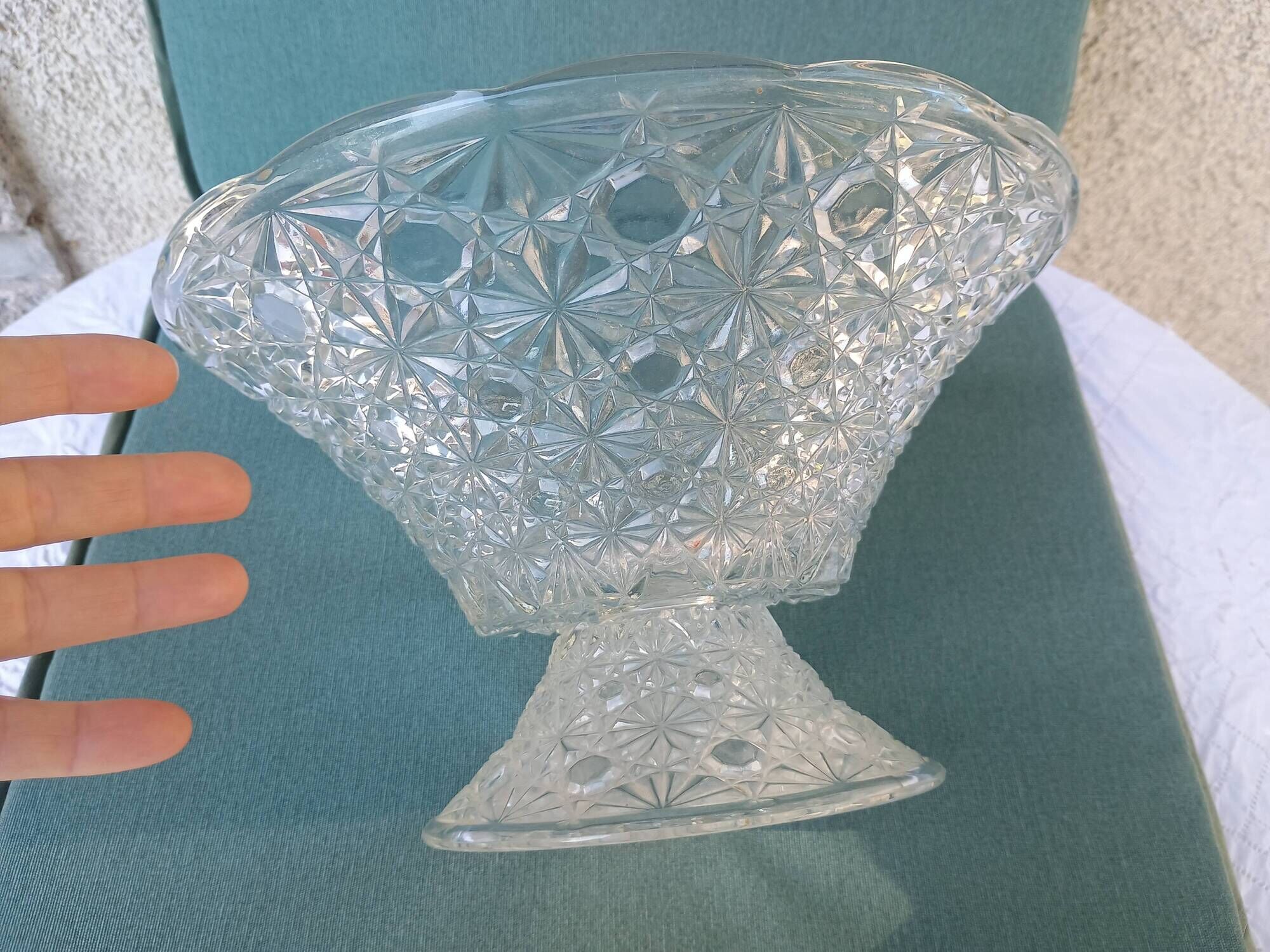 Flared fruit bowl with a pedestal, all made of pressed moulded glass, mid-20th century.