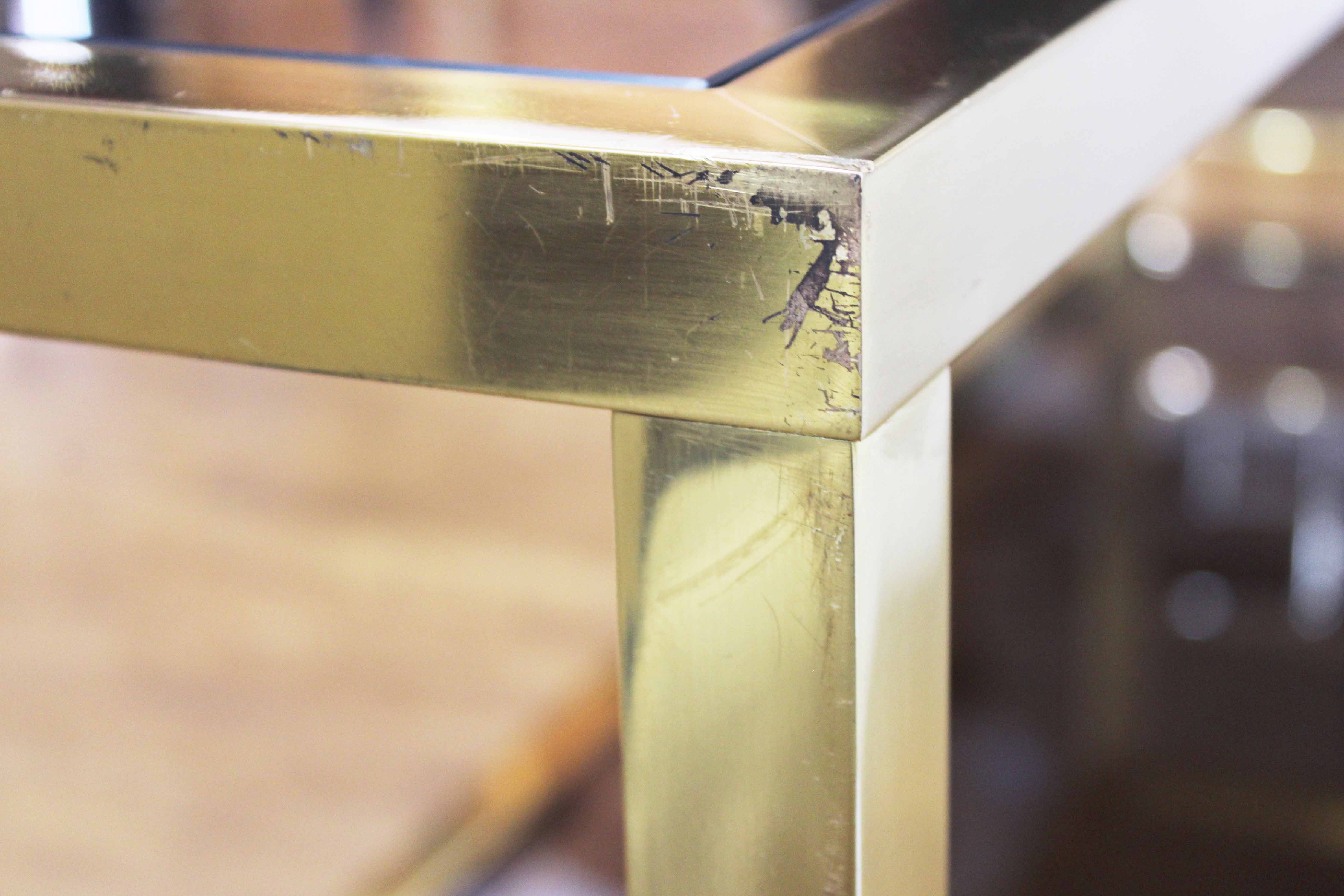 Brass console and smoked glass