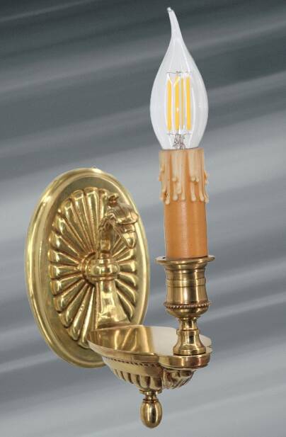 Pair of gilt bronze wall sconces in the Directoire style by Lucien Gau.