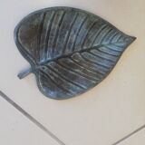 Greenish metal leaf pocket emptier