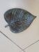 Greenish metal leaf pocket emptier