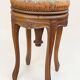 Swivel piano stool with screw, Louis XV style, in walnut.