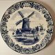 Delft earthenware dish decorated with a mill late 19th early 20th century diameter 39 cm