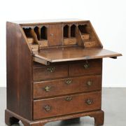 Antique English oak secretary from the 18th century with a stepped interior