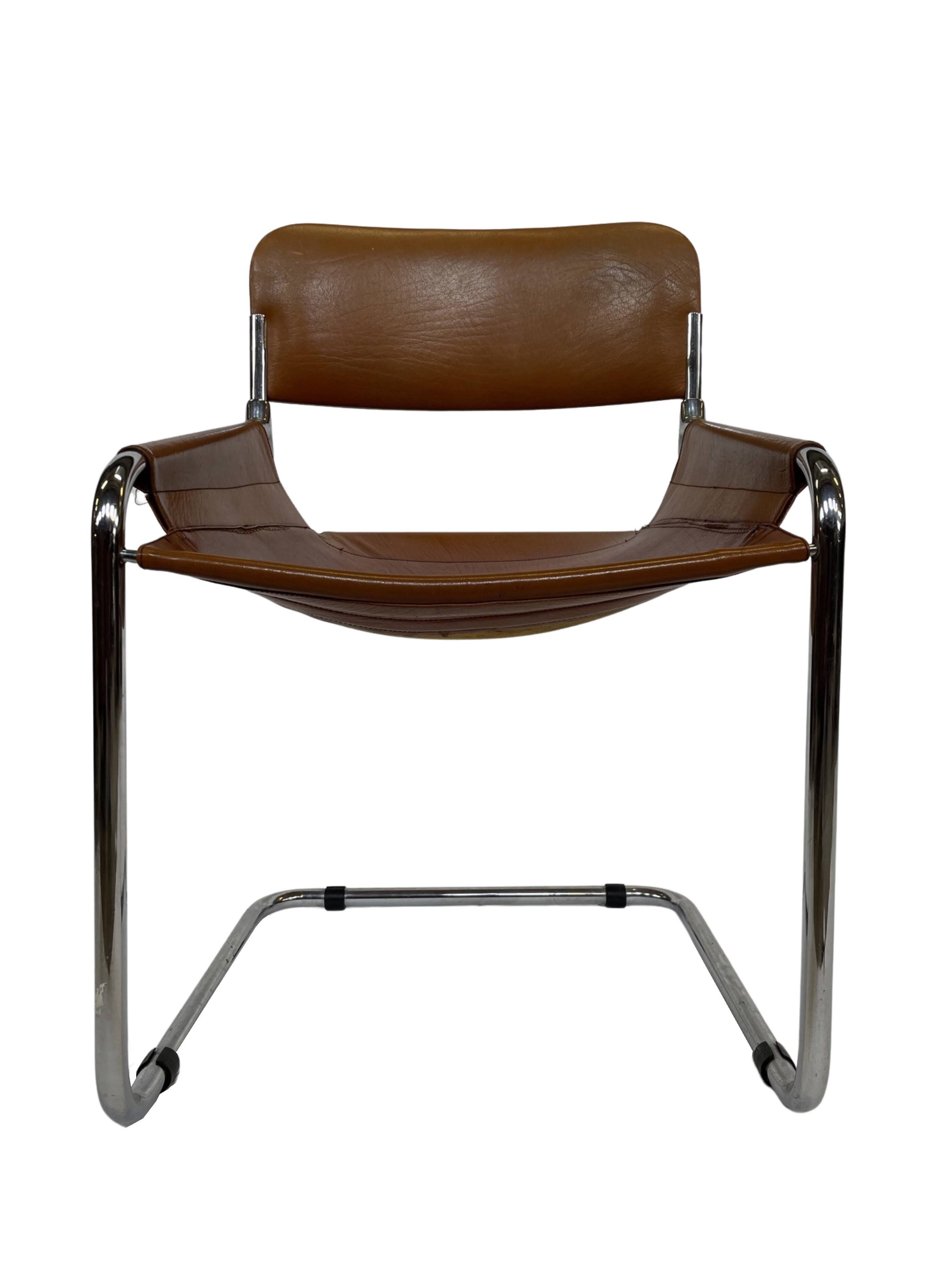 vintage dining room chair in cognac leather and chrome 1970s Italy