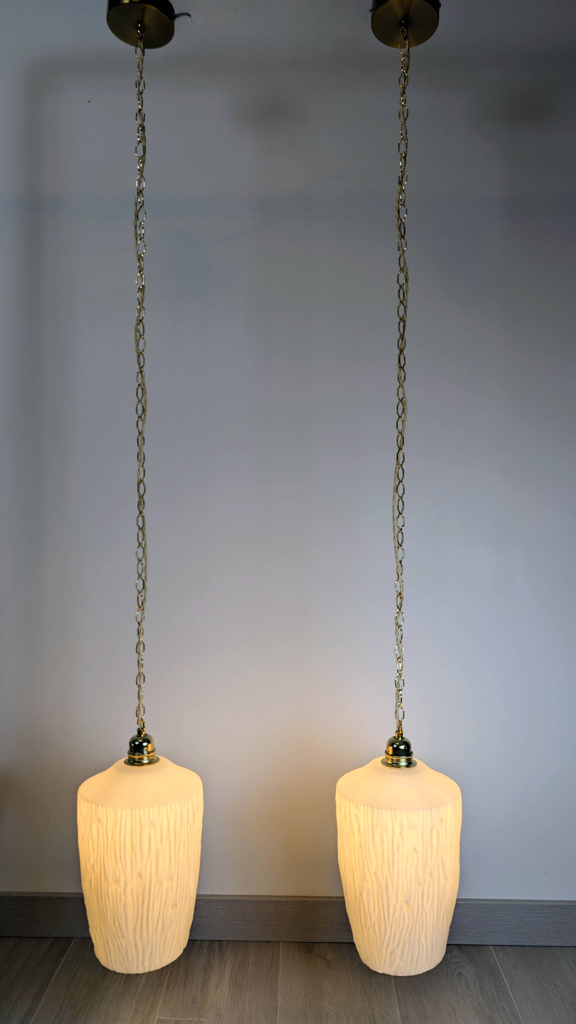 Pair of opaline pendants from the 1960s, luminous simplicity, 140 cm.