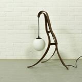 Sculptural table lamp with globe