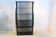 Armoire en verre fumé et laiton