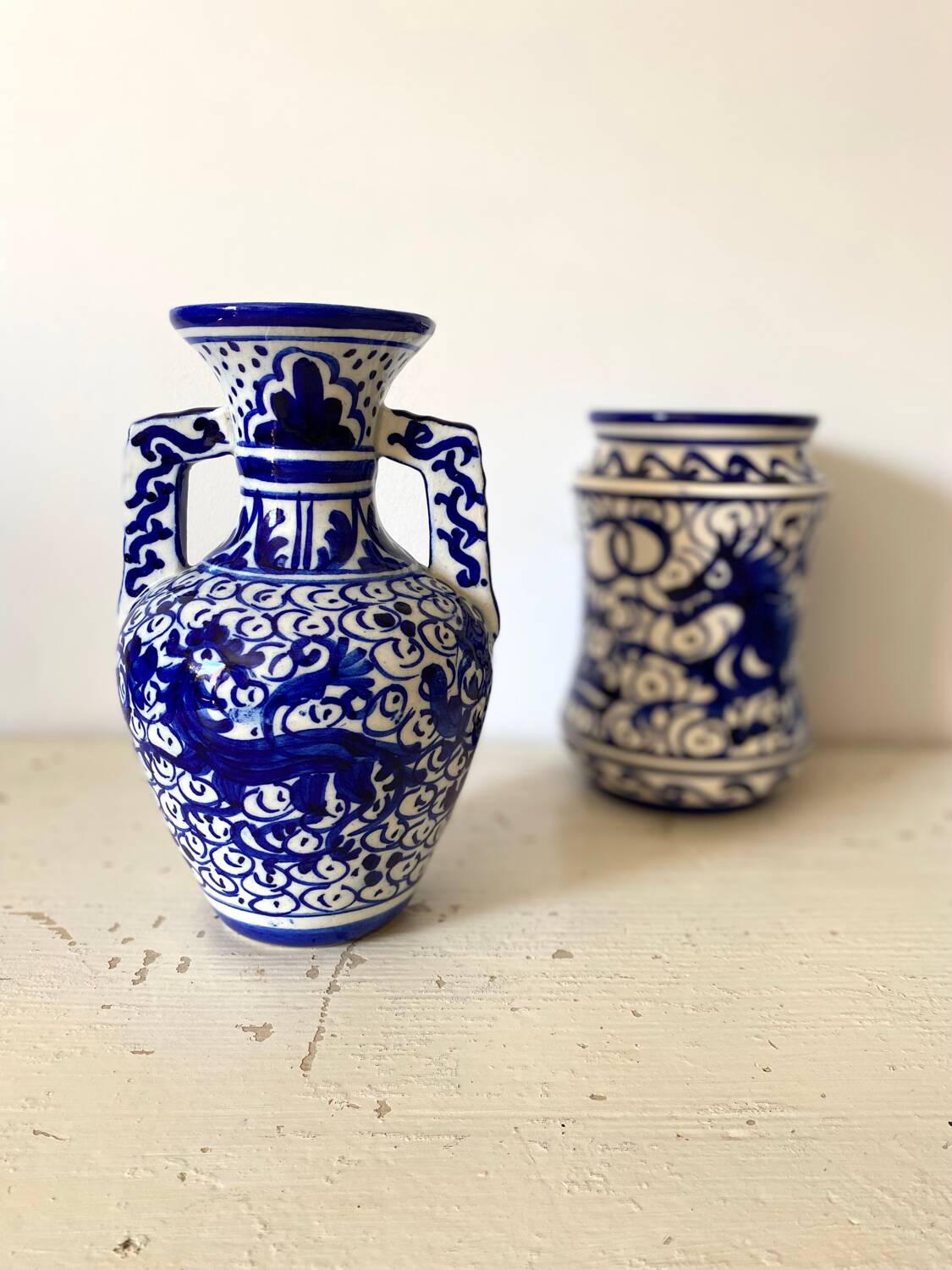 Small amphora vase in old hand-painted ceramic