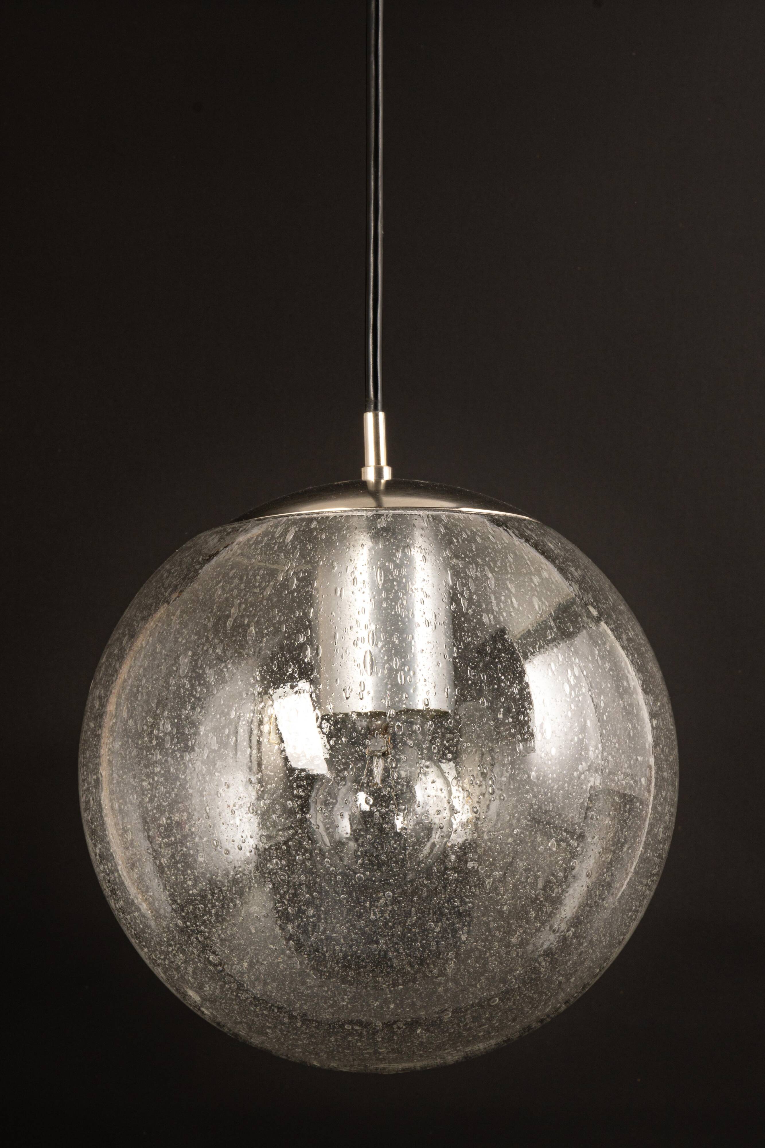 Small Limburg chrome pendant light with transparent glass ball, Germany, 1970s.