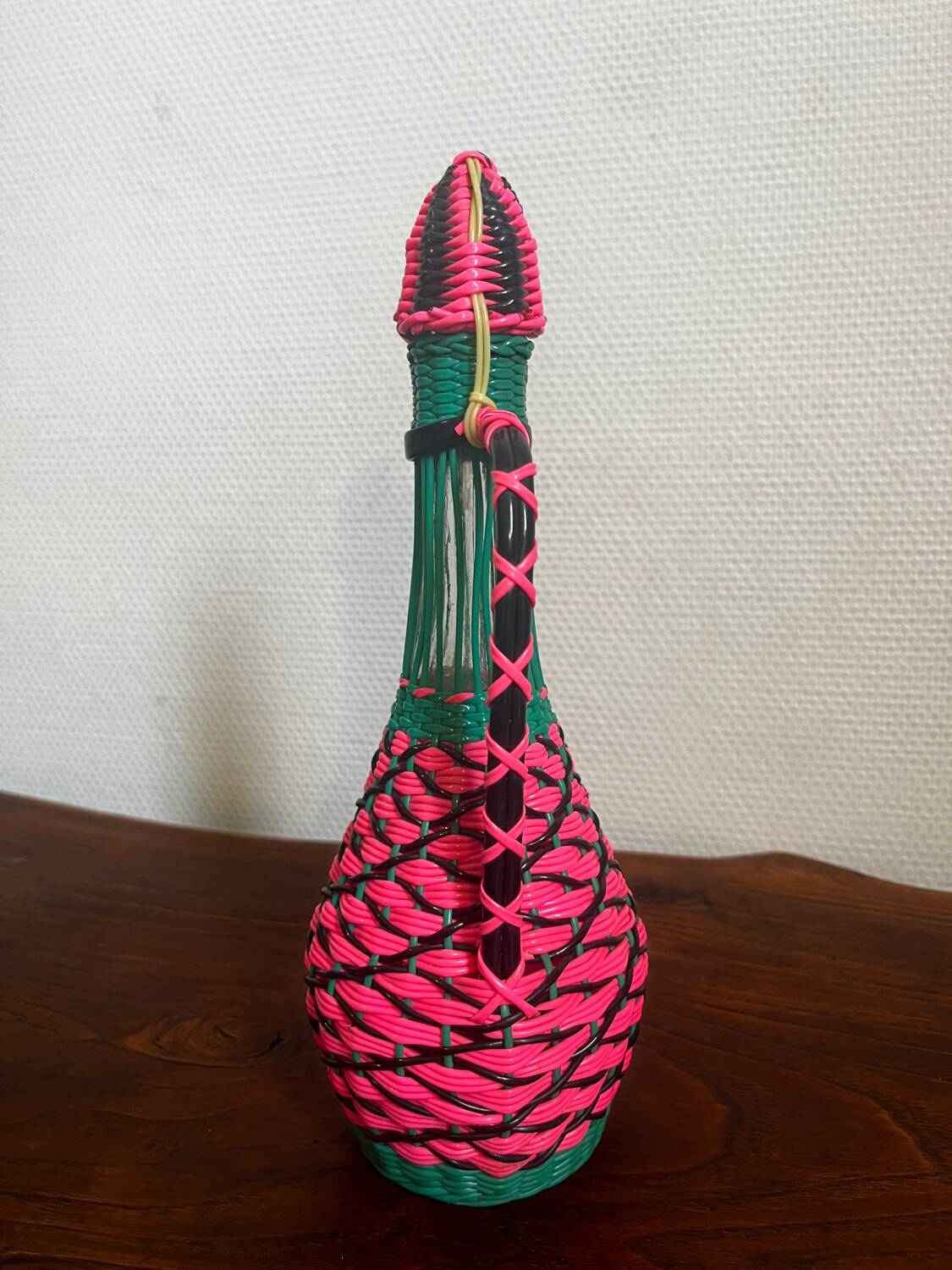 Old glass bottle and scoubidou