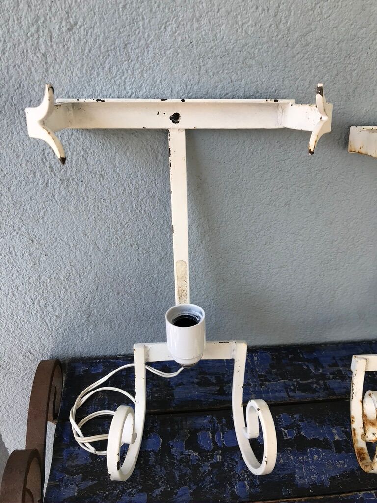 Lot of three terracotta and wrought iron appliques