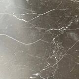 Black marble coffee table with brass legs.