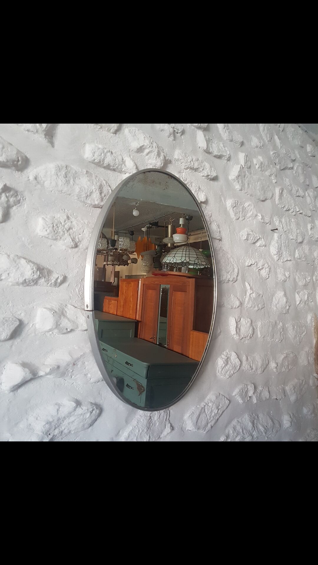 Old aluminum oval mirror