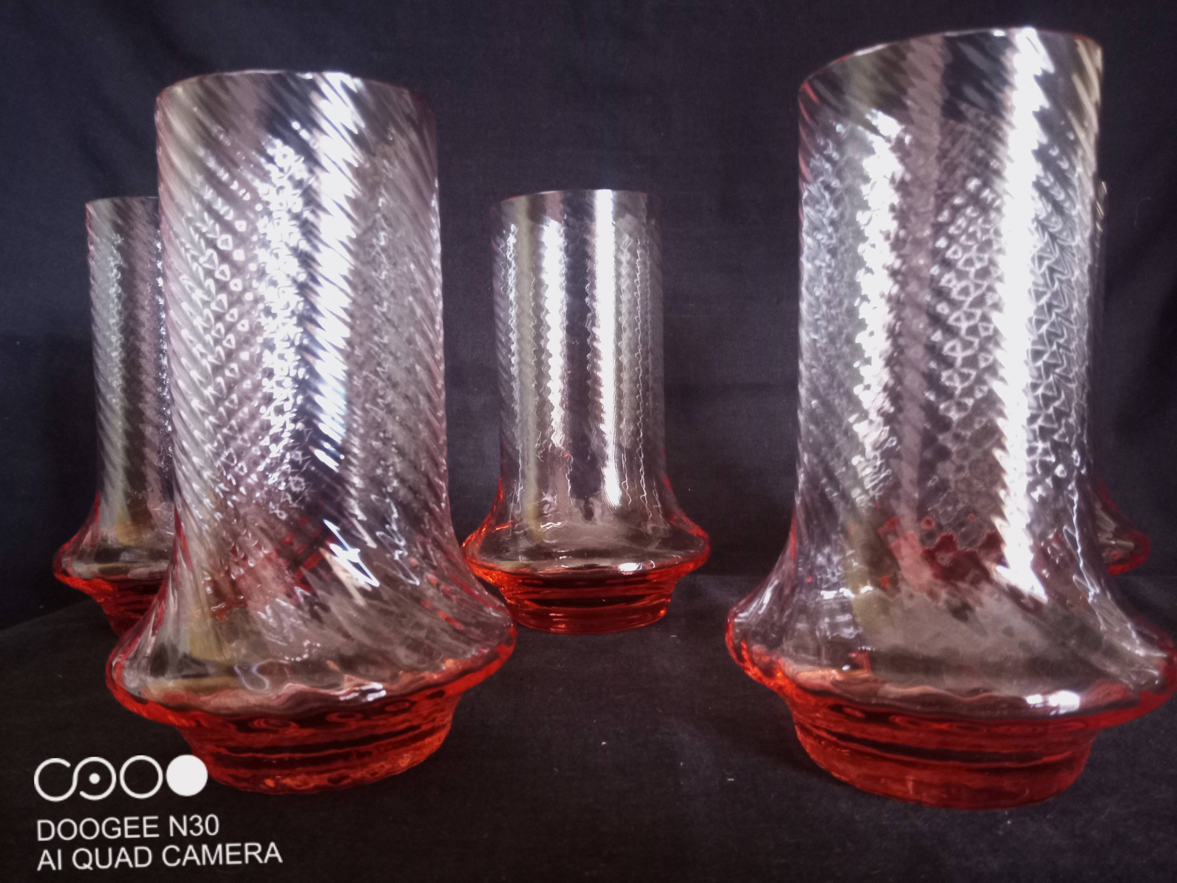 Art Deco orangeade service in pink-orange glass, twisted model.