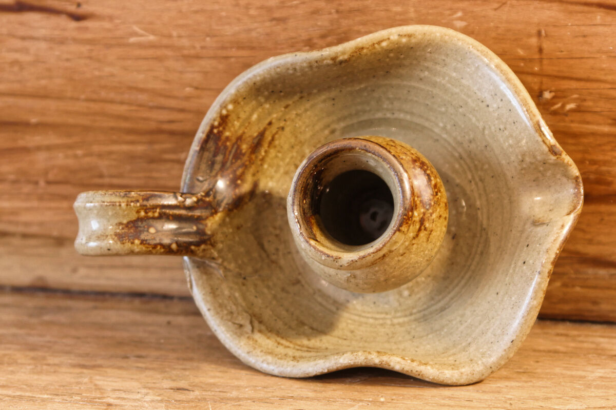 Signed sandstone candle holder