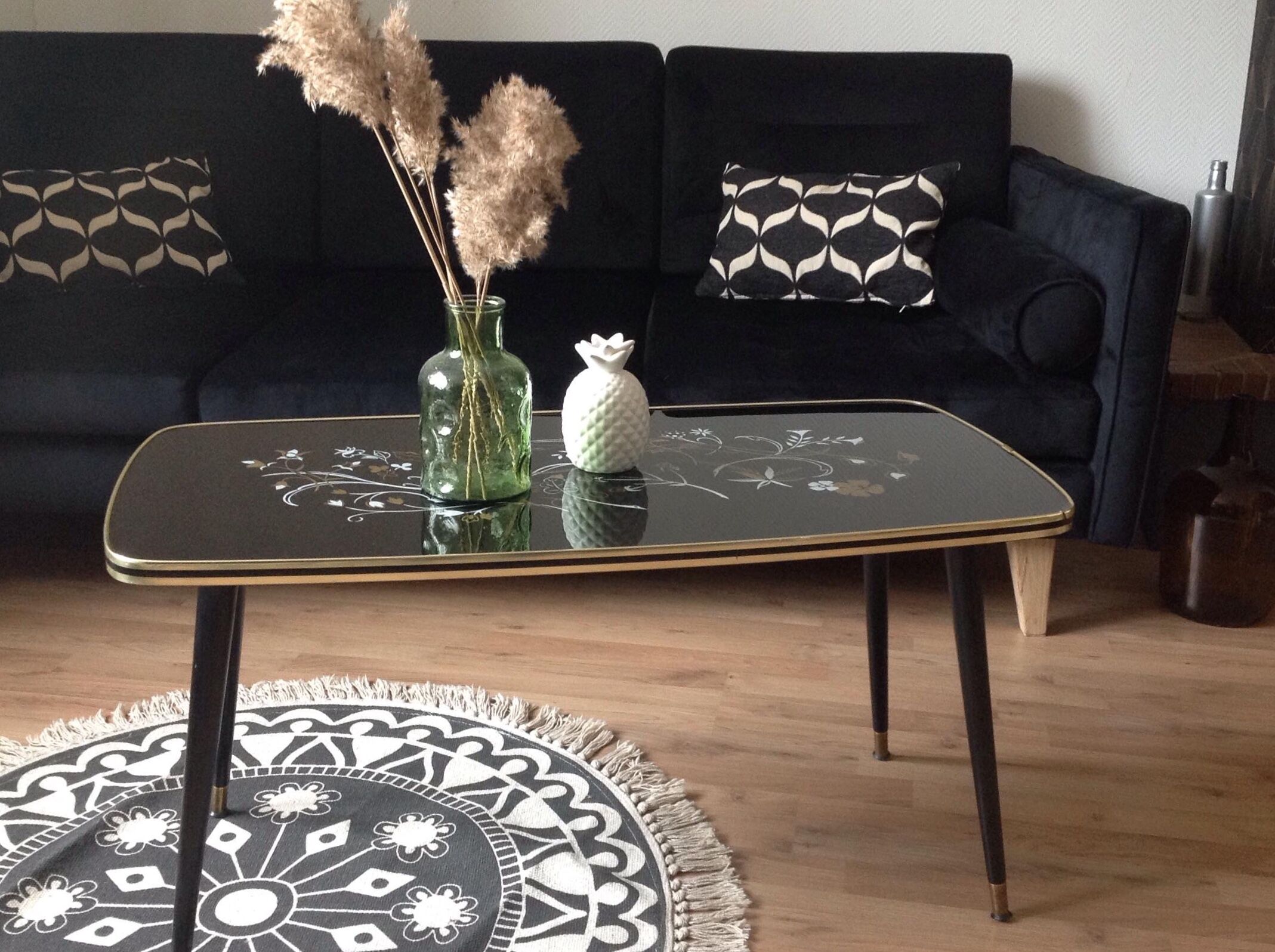 Coffee table, year 60, black with floral patterns