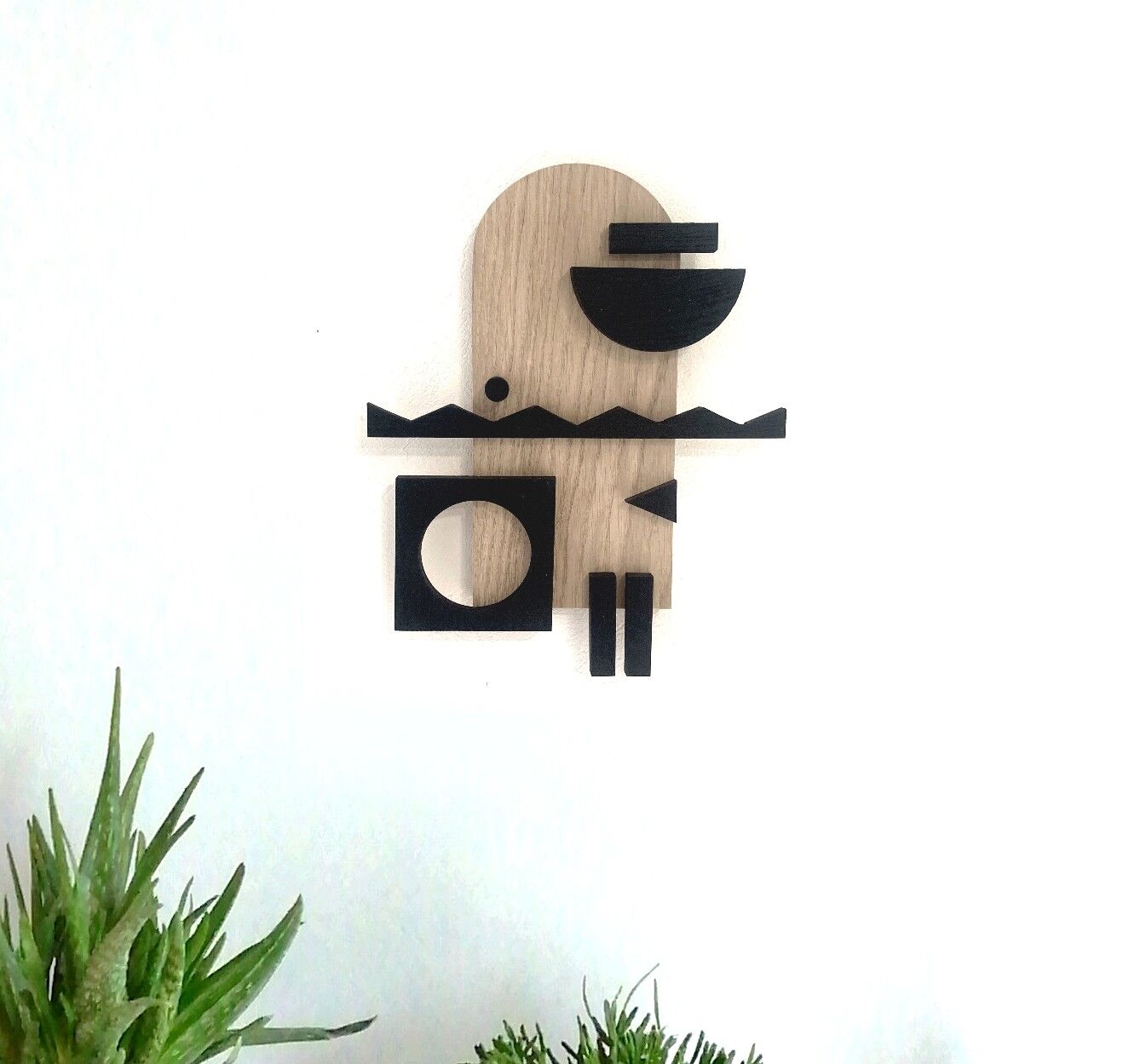 Geometric wooden painting - relief collage of natural and black wood