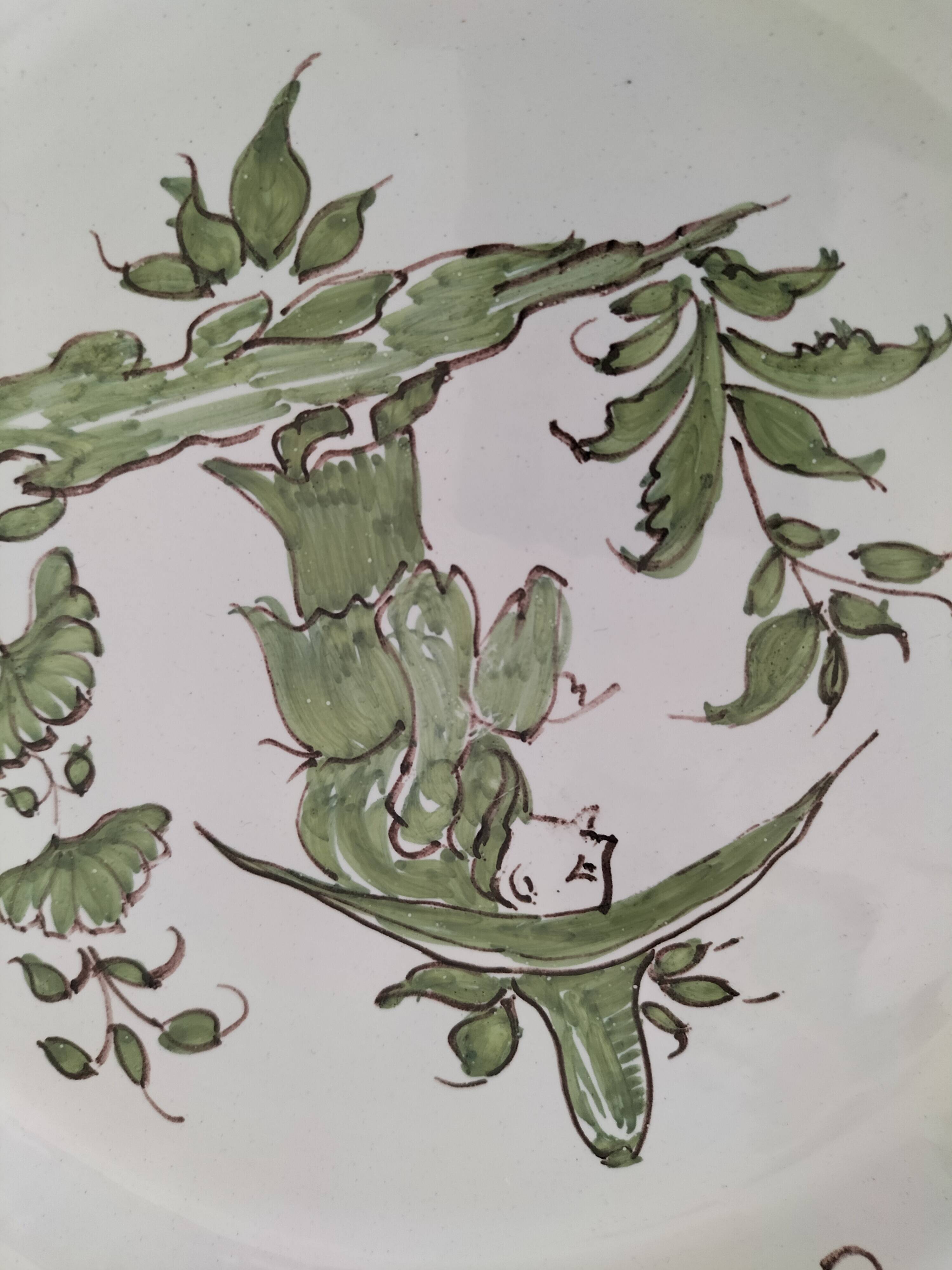 4 hand-painted earthenware plates in a holiday home style